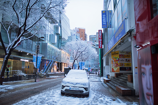 Seoul, Korea - Febrary 22nd 2024, Its the snowy day early morning at Myeong-dong Fashion Street in Downtown Seoul Korea. 서울  명동 새벽