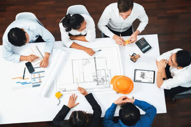 istock Diverse group of civil engineer and client working on architect. Prudent 2031421742