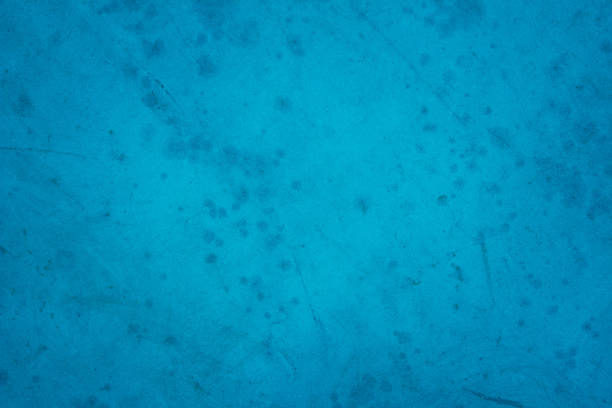Dark blue concrete stone texture for background in summer wallpaper. Cement and sand wall of tone vintage minimal. Concrete abstract wall of light cyan color, cement texture mint green for design.