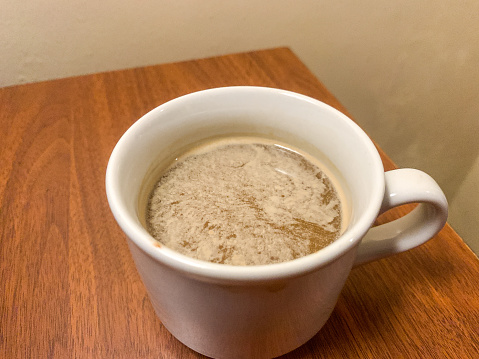A mug of tea on a white background