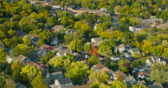 High angle aerial shot of leafy residential streets in Phillips in Minneapolis, Minnesota at sunset. 

Authorization was obtained from the FAA for this operation in restricted airspace.