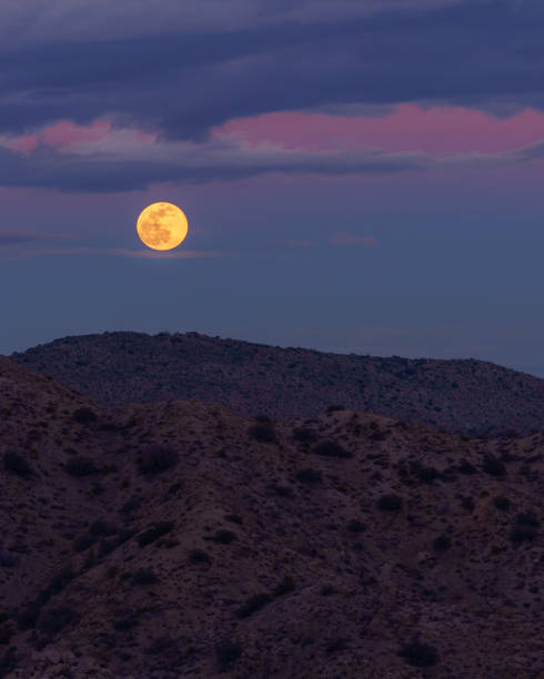 istock Full Moon Rising Over Desert Mountains 2031476938