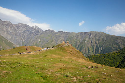 Gergeti Trinity Church with view of  Caucasus mountains