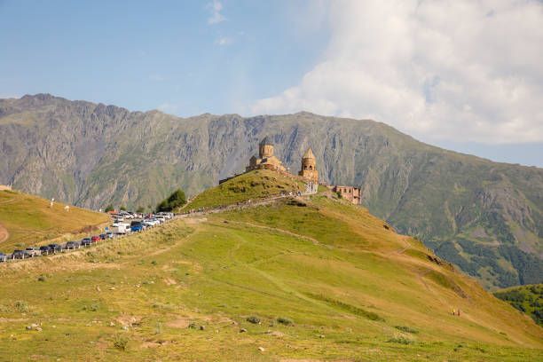 Gergeti Trinity Church with view of  Caucasus mountains