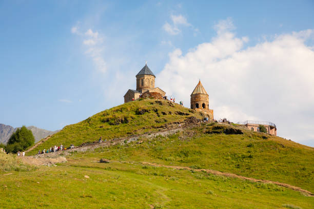 Gergeti Trinity Church with view of  Caucasus mountains