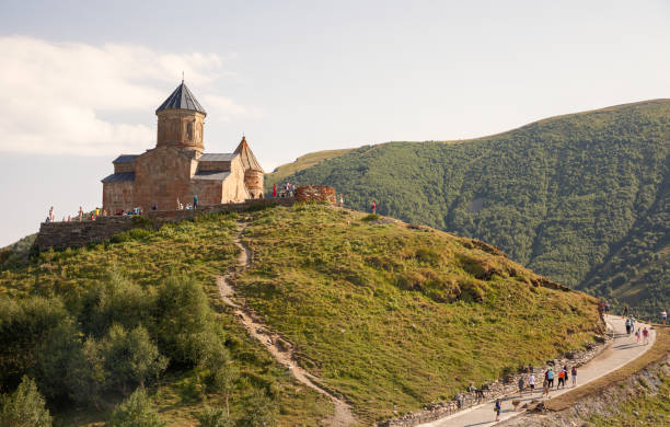 Gergeti Trinity Church with view of  Caucasus mountains