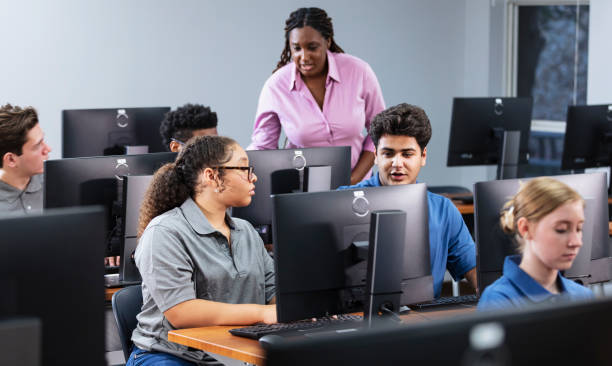 istock High school students and teacher in computer lab 2031588822