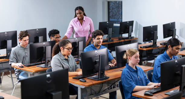 istock High school students and teacher in computer lab 2031588834
