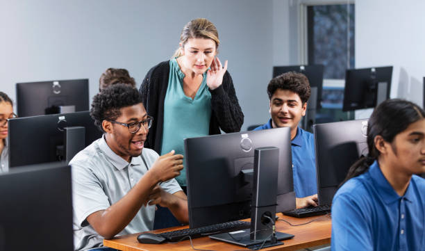 istock High school students and teacher in computer lab 2031589387