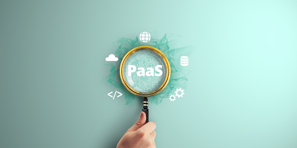 PaaS. Platform as a Service. Empowering Software Development with Cloud Components and Internet Technology, with a Lens on Digital Marketing Success. Magnifier focus to Digital marketing icon.