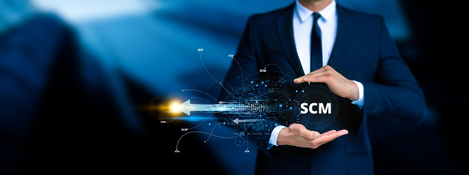 Supply Chain Management (SCM). the end-to-end management of goods and services flow within a business. Businessman touching the scm icon on digital screen