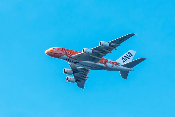 ANA Airbus 380 airplane in orange flying turtle livery. There is also a blue and teal flying turtle livery.