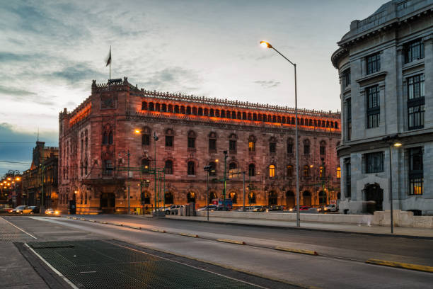 The landmark Postal Palace (Palacio de Correos de Mexico) building in downtown Mexico City at dawn.