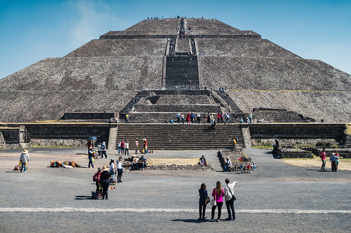 Tourists visit the Pyramid of the Sun, the largest pyramid built in Teotihuacan, near Mexico City, Mexico on a sunny day.
