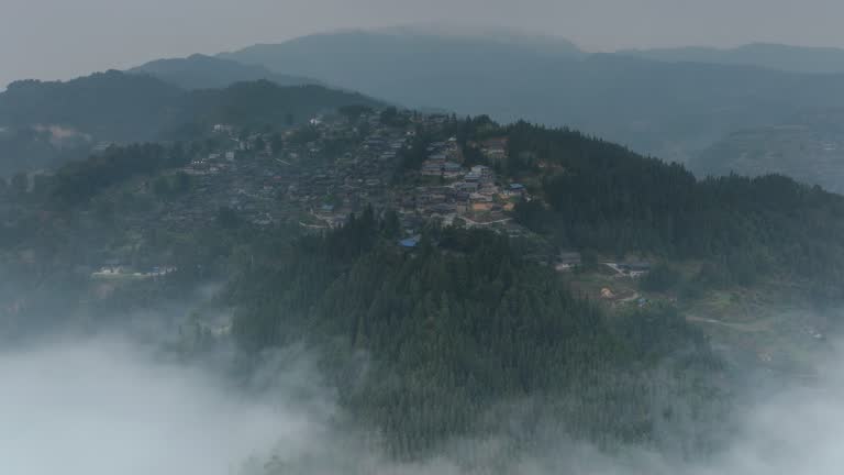 A large Miao village is above the clouds and mist