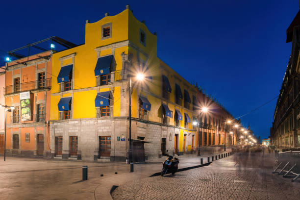 Calle Moneda, a pedestrian street at Zocalo, in old town Mexico City, Mexico at night.