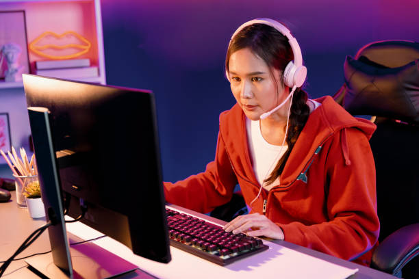 istock Host channel Asian streamer concentrating game wearing headphone. Stratagem. 2031679440
