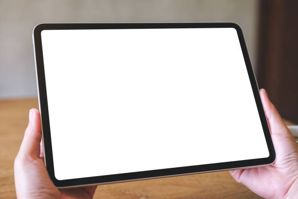 istock Mockup image of a woman holding digital tablet with blank white desktop screen 2031715974