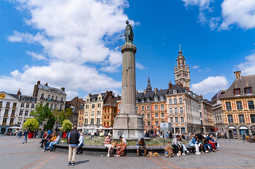burges/Belgium- Oct 28 2019:crowd tourists walking in Grote Markt square and Belfort tower in Bruges, Belgium.