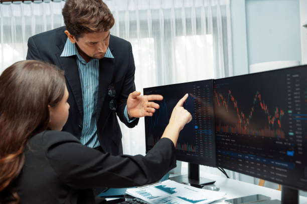istock Two business traders discussing business statistic on report paper. Postulate. 2031805241
