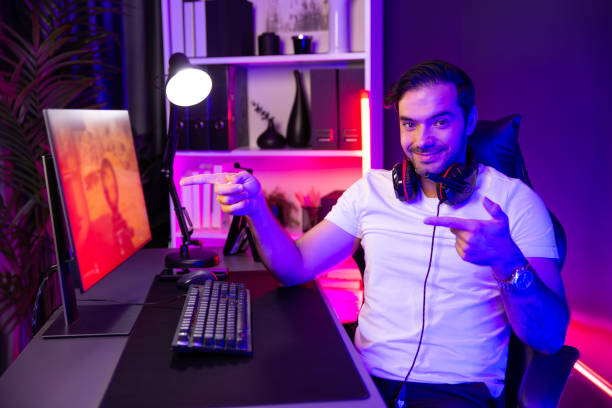 istock Smart gaming streamer looking at camera with pose playing shooting. Surmise. 2031809339