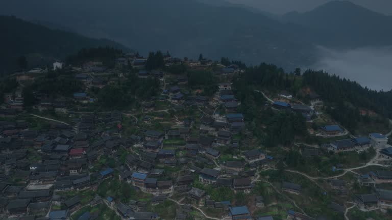A large Miao village is above the clouds and mist