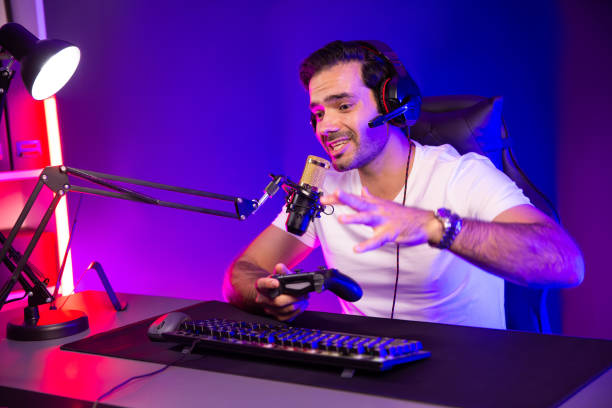 istock Streamer talking with team member players with joystick control game. Surmise. 2031830799
