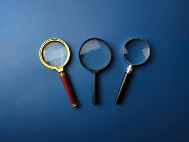 istock Top view vintage and modern magnifying glass 2031840652
