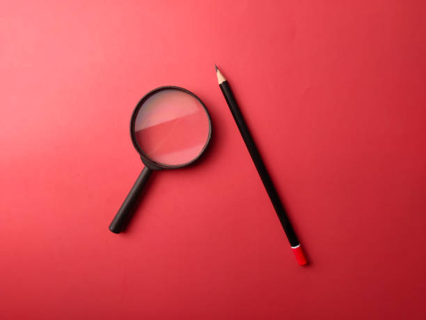istock Top view pencil and magnifying glass 2031843245