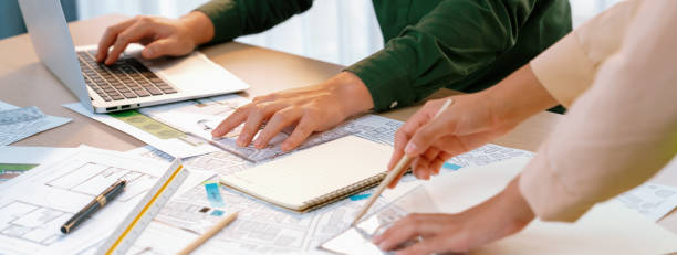 istock Professional engineer team discussion about house design. Closeup. Delineation. 2031853656