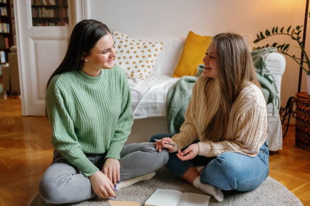istock Two Friends Sharing a Joyful Moment at home 2031855760