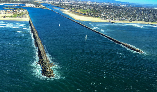 Aerial photo of the Mission Bay Inlet between Mission Beach and Ocean Beach along the San Diego County Coastline.