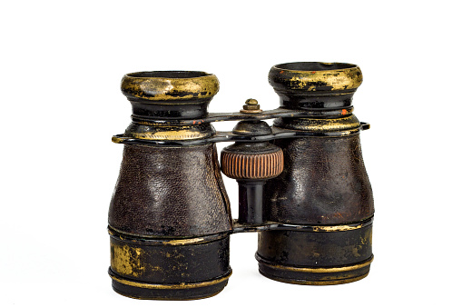 Antique binoculars on white