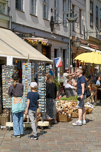 Berlin, Germany – May 28, 2023: Tourists at a souvenir store in the popular Nikolai quarter in the center of Berlin