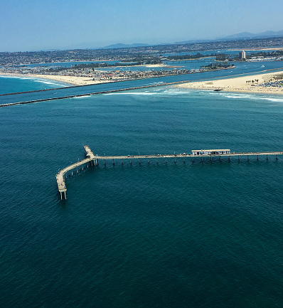 Aerial photo of Mission Beach and the Ocean Beach Pier along the San Diego County Coastline.