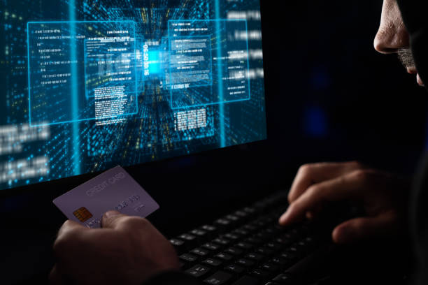 istock Criminal anonymous male approaching credit card's personal information. Surmise. 2031880839