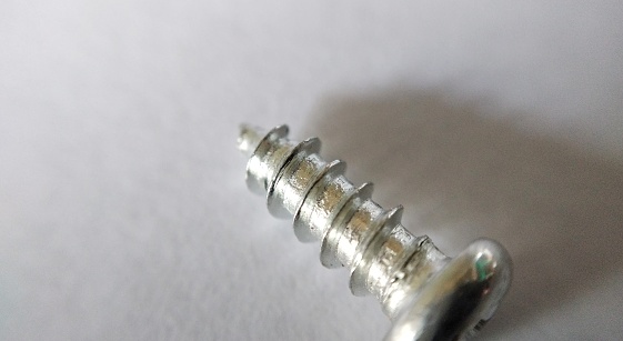 Screws on a white background. Close-up. Macro
