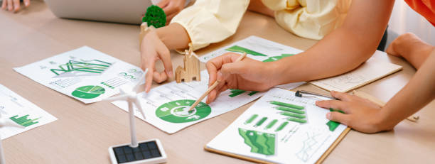 istock Green business meeting about using renewable energy. Closeup. Delineation. 2031929046