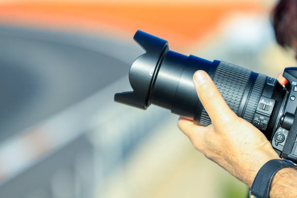 istock amateur photographer camera on racing competition circuit 2031956375