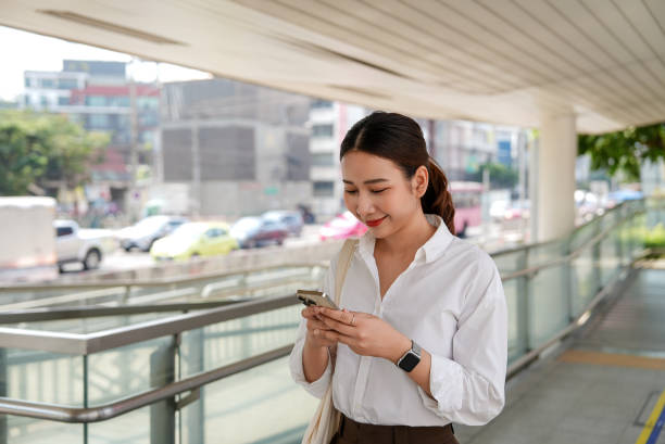 istock Asian woman using a smartphone 2031956895