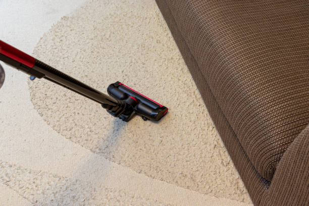 istock Cleaning around the sofa in the living room using a vacuum cleaner 2031970802