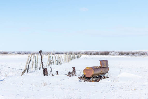 The abandoned Remnants in a vast snowy field
