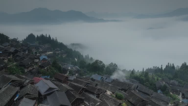 A large Miao village is above the clouds and mist