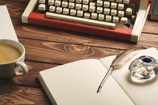 Vintage typewriter on wooden table close up photo