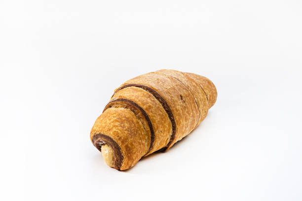 istock Fresh chocolate croissant with nut mousse on white isolated background 2032021316