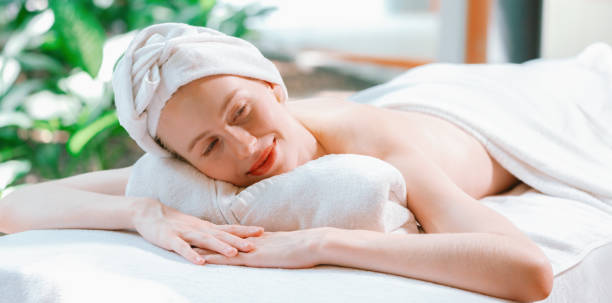 istock Beautiful young woman relaxes on a spa bed surrounded by nature. Tranquility 2032050496