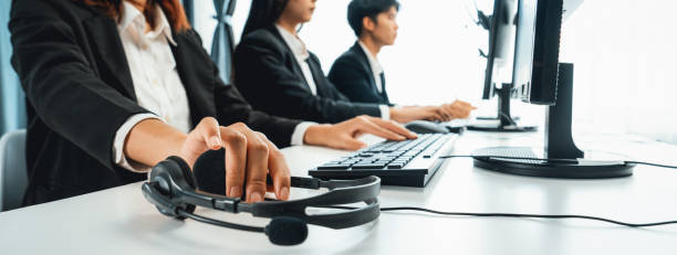Call center wearing headset working in office for customer support oratory
