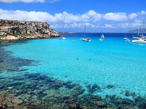 The turquoise waters at Cala Rossa, on the island of Favignana in the Egadi Archipelago, Sicily, Italy.