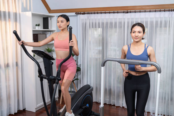 istock Energetic and strong athletic asian woman running on machine. Vigorous 2032068724