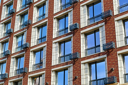 the facade of a multi-storey residential building in Almaty, Kazakhstan